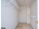 Walk-in closet with ample shelving and soft carpet, ready for organization at 2938 Cottesford Se Way, Smyrna, GA 30080