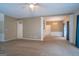 Bright and airy living room featuring carpet, columns, and an entrance to another room at 2938 Cottesford Se Way, Smyrna, GA 30080