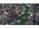 Aerial view of a waterfront home on Jackson Lake surrounded by trees and other homes at 315 Jewel Ln, Covington, GA 30014