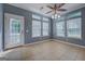 Bright dining area with tile floors, multiple windows, and a door to the patio at 315 Jewel Ln, Covington, GA 30014