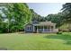 Charming single-story home featuring a spacious porch and a well-maintained, expansive front lawn at 315 Jewel Ln, Covington, GA 30014