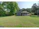 Charming single-story home featuring a spacious porch and a well-maintained, expansive front lawn at 315 Jewel Ln, Covington, GA 30014