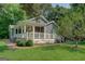 Inviting home showcasing a charming, covered porch with white railings and an outdoor seating area at 315 Jewel Ln, Covington, GA 30014