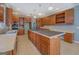 Large gourmet kitchen featuring custom wood cabinets, modern appliances, an island, and lots of light at 315 Jewel Ln, Covington, GA 30014