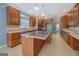 Expansive kitchen with custom wood cabinets, modern appliances, and a central island at 315 Jewel Ln, Covington, GA 30014