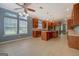 Eat-in kitchen with tile floors, island, and ample natural light from several windows at 315 Jewel Ln, Covington, GA 30014