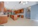 Large eat-in kitchen featuring an island, custom cabinets, tile floors, and stainless appliances at 315 Jewel Ln, Covington, GA 30014