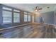 Open-concept living room boasting lots of natural light, neutral paint, new floors, and ceiling fan at 315 Jewel Ln, Covington, GA 30014