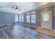 Spacious living room with new flooring, a ceiling fan, and an abundance of natural light from the windows at 315 Jewel Ln, Covington, GA 30014