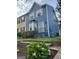 Charming blue two-story home features a bay window, a well-manicured front yard, and inviting curb appeal at 2540 Picardy N Cir # B, South Fulton, GA 30349