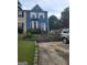 Charming two-story home with blue siding and a well-manicured front yard, featuring a lovely bay window at 2540 Picardy N Cir # B, South Fulton, GA 30349