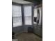 Bright kitchen corner with stainless steel refrigerator and natural light from two windows at 2540 Picardy N Cir # B, South Fulton, GA 30349