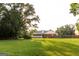 Large backyard with green grass, swing set, and screened in porch at 30 Carolyn Ct, Social Circle, GA 30025