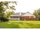 Well maintained backyard with luscious green lawn and swing set at 30 Carolyn Ct, Social Circle, GA 30025
