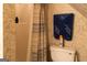 Cozy bathroom with shower, toilet, and blue towel at 30 Carolyn Ct, Social Circle, GA 30025