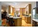 Open kitchen design with light-wood cabinets and granite countertops at 30 Carolyn Ct, Social Circle, GA 30025