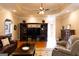 Open living area featuring a built-in entertainment center, hardwood floors, and comfortable seating, creating a welcoming space at 30 Carolyn Ct, Social Circle, GA 30025