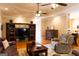 Spacious living room featuring a built-in entertainment center, hardwood floors, and comfortable seating, perfect for relaxation at 30 Carolyn Ct, Social Circle, GA 30025