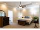 Spacious main bedroom with large bed, neutral colors, recessed lights, ceiling fan, and walk-in closet at 30 Carolyn Ct, Social Circle, GA 30025
