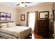 Spacious main bedroom with hardwood floors, ensuite, and a chest of drawers at 30 Carolyn Ct, Social Circle, GA 30025