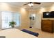 Comfortable main bedroom featuring a ceiling fan, recessed lighting, and access to an ensuite bathroom at 30 Carolyn Ct, Social Circle, GA 30025