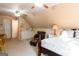 Bright main bedroom features vaulted ceiling, ceiling fan, and ensuite with vanity at 30 Carolyn Ct, Social Circle, GA 30025