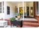 Charming patio space with comfortable seating and planters on a brick base at 30 Carolyn Ct, Social Circle, GA 30025