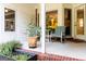 Cozy outdoor patio space with striped seating and potted plants, perfect for relaxing at 30 Carolyn Ct, Social Circle, GA 30025