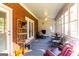 Inviting sunroom with brick accents, ceiling fan, and access to the backyard at 30 Carolyn Ct, Social Circle, GA 30025