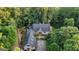 Aerial view of estate featuring mature trees surrounding the home, and additional buildings; perfect for tranquil living at 223 Old Rome Rd, Kingston, GA 30145