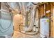 Basement utility area featuring a furnace, ductwork, and water heater at 223 Old Rome Rd, Kingston, GA 30145