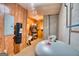 Basement storage area with wood paneled walls and a large water tank at 223 Old Rome Rd, Kingston, GA 30145