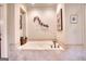Bathroom featuring a soaking tub with tile surround and modern fixtures at 223 Old Rome Rd, Kingston, GA 30145