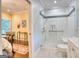 Modern bathroom features a glass-enclosed shower with convenient grab bar and bright, neutral finishes at 223 Old Rome Rd, Kingston, GA 30145