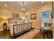 Comfortable bedroom with hardwood floors, a decorative chandelier and ample natural light from the multiple windows at 223 Old Rome Rd, Kingston, GA 30145