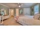 A spacious bedroom featuring a large bed, carpeted floors, and lots of natural light at 223 Old Rome Rd, Kingston, GA 30145