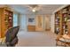 Large bonus room with bookshelves, seating, and neutral carpet at 223 Old Rome Rd, Kingston, GA 30145