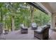 Wood deck with black railings and wicker furniture with a view of trees at 223 Old Rome Rd, Kingston, GA 30145