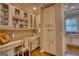 Brightly lit desk area with custom cabinets and shelves for organization at 223 Old Rome Rd, Kingston, GA 30145