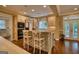 Well-lit kitchen with island, granite countertops, and access to the outdoors at 223 Old Rome Rd, Kingston, GA 30145