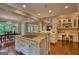 Open kitchen with granite counters, island, and dining room in the background at 223 Old Rome Rd, Kingston, GA 30145