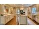 Bright kitchen with granite countertops, center island, and ample storage at 223 Old Rome Rd, Kingston, GA 30145