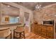 Butler's pantry kitchenette with brick wall, wood floors, and breakfast bar at 223 Old Rome Rd, Kingston, GA 30145