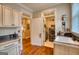 Laundry room with washer, sink, tile floor and ample storage cabinets at 223 Old Rome Rd, Kingston, GA 30145