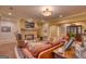Cozy living room featuring a stone fireplace, leather furniture, and comfortable decor at 223 Old Rome Rd, Kingston, GA 30145
