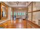 Open concept living room with hardwood floors, and a wall of windows for lots of natural light at 223 Old Rome Rd, Kingston, GA 30145