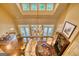 Bright living room with hardwood floors, chandelier, and doors to the outside at 223 Old Rome Rd, Kingston, GA 30145
