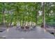 Outdoor patio features a fire pit, seating and forest views with a hammock for relaxation, offering serene ambiance at 223 Old Rome Rd, Kingston, GA 30145
