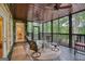 Covered porch with ceiling fans and an outdoor seating area with a view of trees at 223 Old Rome Rd, Kingston, GA 30145