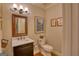 Traditional powder room with marble countertop vanity and decorative wall art at 223 Old Rome Rd, Kingston, GA 30145